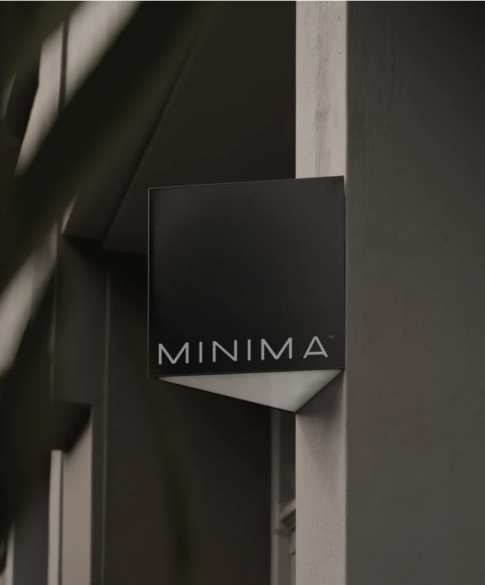 Minima sign mounted on an exterior wall